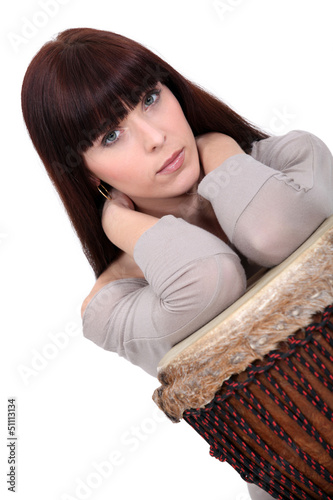 Photo: Brunette posing with bongo Brunette posing with bongo