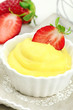 Delicious vanilla cream dessert with fresh strawberries