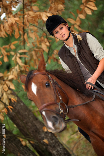 Photo: Blond woman riding horse Blond woman riding horse