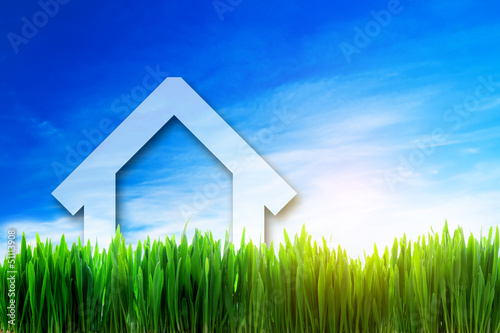 Photo: New house perspective on green sunny field New house perspective on green sunny field