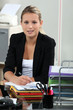 Blond receptionist sat at her desk