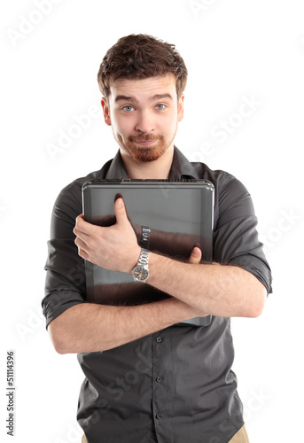 Photo: Happy young man with laptop - isolated on white Happy young man with laptop - isolated on white