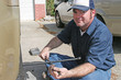 Mechanic Using Tire Iron