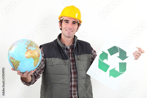 Photo: A manual worker promoting recycling. A manual worker promoting recycling.