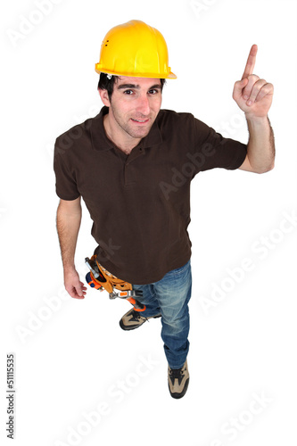 Photo: high angle shot of craftsman pointing upwards high angle shot of craftsman pointing upwards