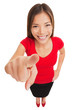 Woman pointing camera smiling happy