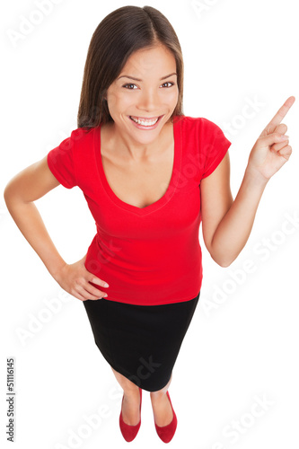 Photo: Pointing showing woman smiling cheerful Pointing showing woman smiling cheerful
