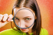 young woman with magnifying glass