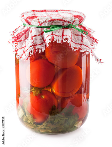 Photo: Canned Tomatoes in Glass Jar isolated on white background Canned Tomatoes in Glass Jar isolated on white background