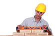 mason working with a level