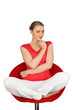 Pensive blond sat cross-legged on swivel chair