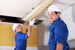 Two electricians with neon