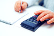 Closeup of a businessman calculating