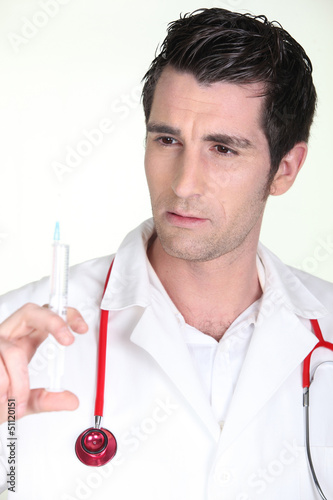 Photo: Man with syringe Man with syringe