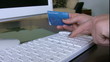 Woman confirming credit card data for e-commerce.