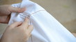 woman embroidery white cloth