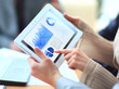 Business people discussing and analyzing market