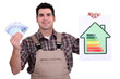 Worker holding money and an energy efficiency rating chart
