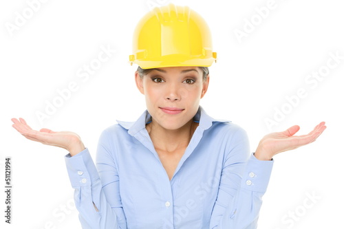 Photo: Engineer, entrepreneur or architect woman shrugging Engineer, entrepreneur or architect woman shrugging