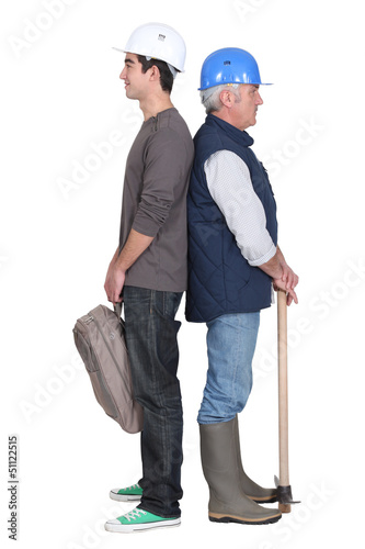 Photo: A handyman and his trainee. A handyman and his trainee.