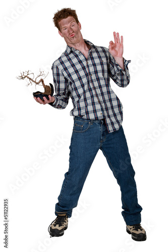 Photo: Strange man stood with burnt plant Strange man stood with burnt plant
