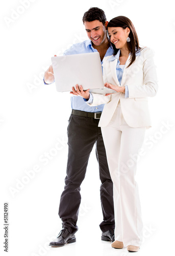 Photo: Business couple with a laptop Business couple with a laptop
