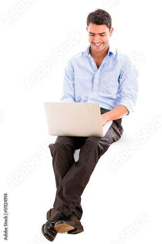 Photo: Business man using a laptop Business man using a laptop