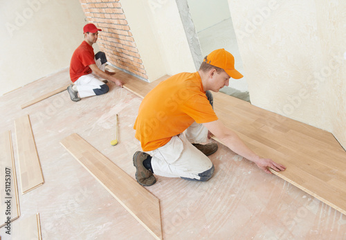 Photo: parquet workers at flooring work parquet workers at flooring work