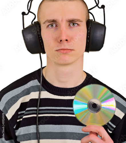 Photo: Sad disappointed man with big headphones and CD Sad disappointed man with big headphones and CD