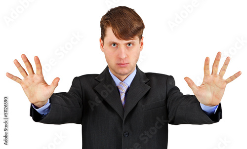Photo: Serious business man with stopping gesture isolated on white Serious business man with stopping gesture isolated on white