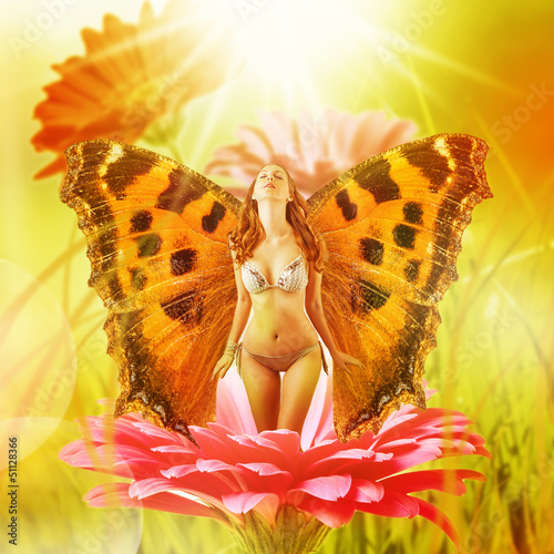 Photo: fairy with wings on a flower fairy with wings on a flower