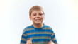 The boy laughs. Joyful happy child.	Surprised boy claps