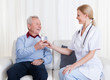 Foto: Caring Doctor Giving Water To Patient Caring Doctor Giving Water To Patient