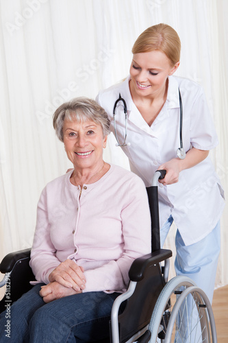 Photo: Caring Doctor Helping Handicapped Patient Caring Doctor Helping Handicapped Patient