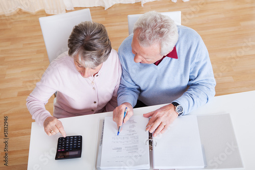 Photo: Senior Couple Calculating Budget Senior Couple Calculating Budget