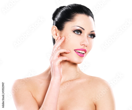 Photo: Beautiful expressive woman cares of the skin face Beautiful expressive woman cares of the skin face