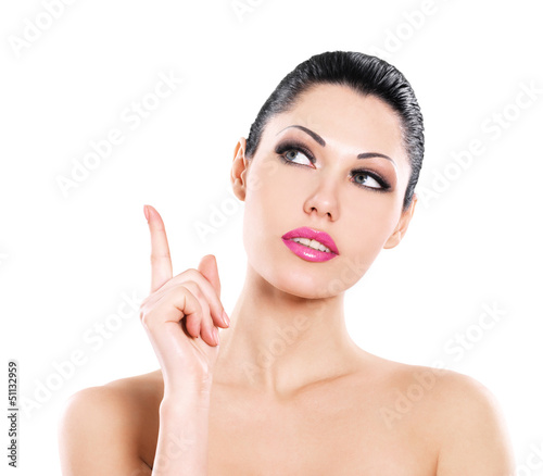 Photo: Beautiful expressive woman cares of the skin face Beautiful expressive woman cares of the skin face
