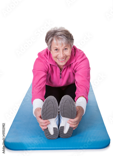 Photo: Senior Woman Stretching Her Legs Senior Woman Stretching Her Legs