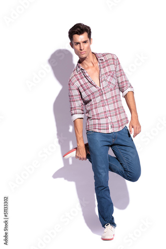 Photo: man holding leg man holding leg