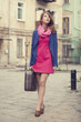 portrait of a beautiful girl on the street.  Photo in vintage st