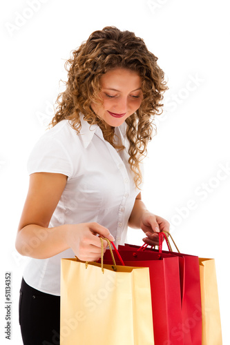 Photo: Young woman holding shopping bags isolated on white background Young woman holding shopping bags isolated on white background