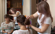 hair stylist work on woman hair