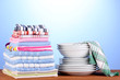 kitchen towels with dishes on blue background close-up