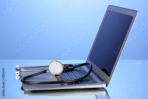 Photo: Silver notebook with a stethoscope Silver notebook with a stethoscope