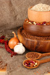 Raw wheat,buckwheat and beans in wooden bowls