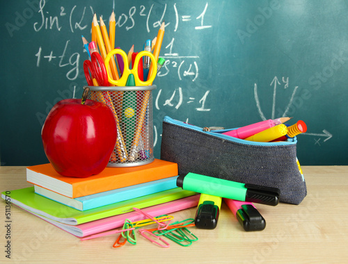 Photo: Back to school - blackboard with pencil-box and school Back to school - blackboard with pencil-box and school