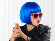 girl with blue wig and smoking gun