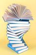 Spiral books on beige background