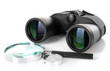 Black modern binoculars with magnifying glass and compass