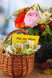 Many different flowers in baskets on room background